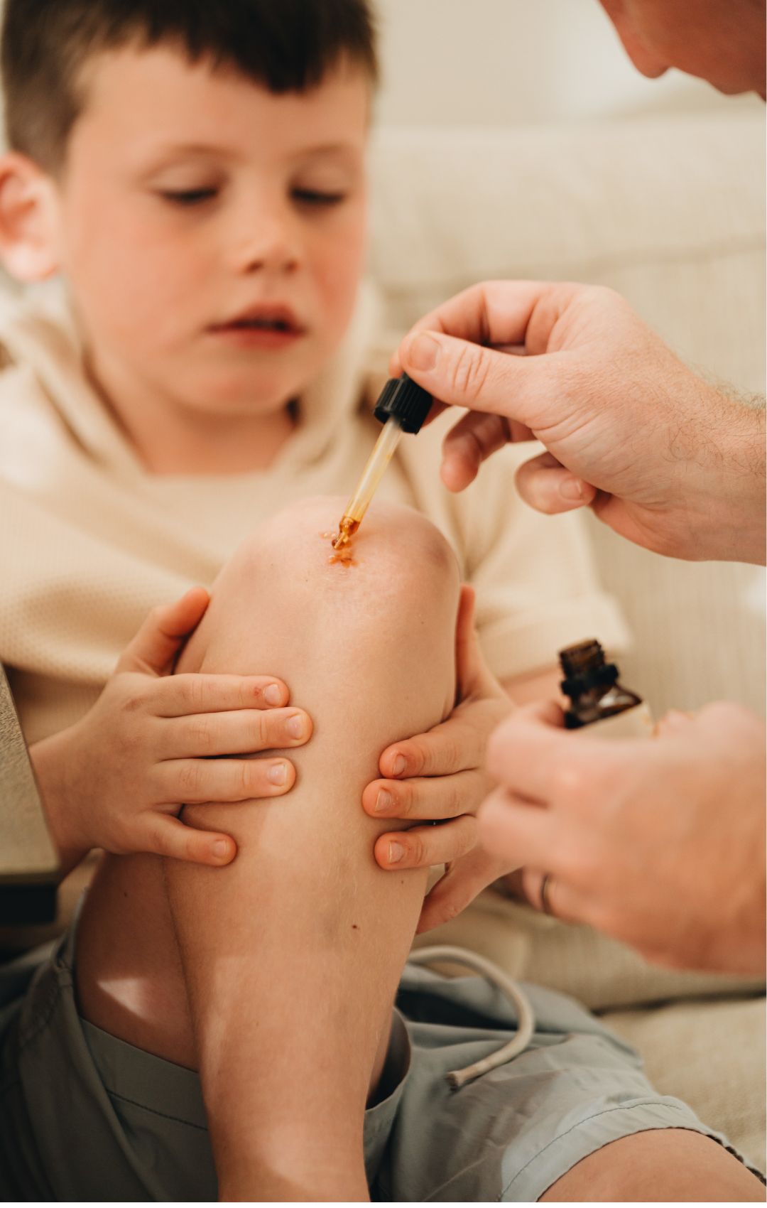 A child having a knee wound treated