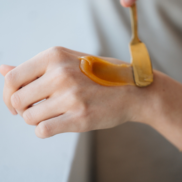 Hand with cream applied