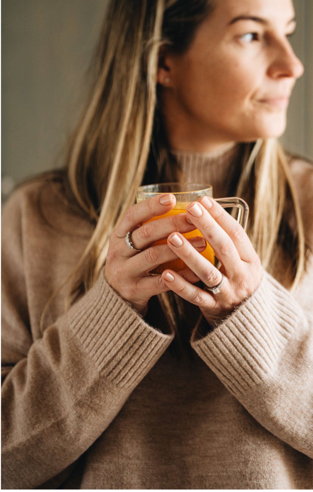 A woman holding a cup
